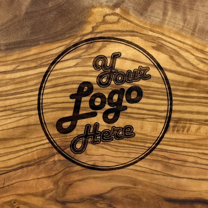 Brett mit Saftrille oval Olivenholz ca. 30x12 cm